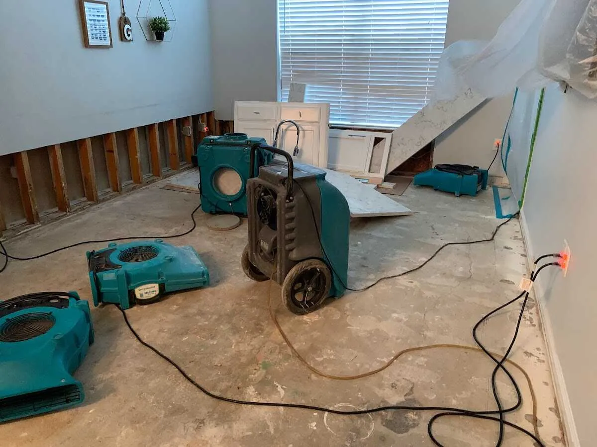 Dehumidifier in flood-cut room for Water Damage Restoration in Milltown